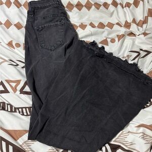 Vibrant Black Flare Jeans with Frayed Hem